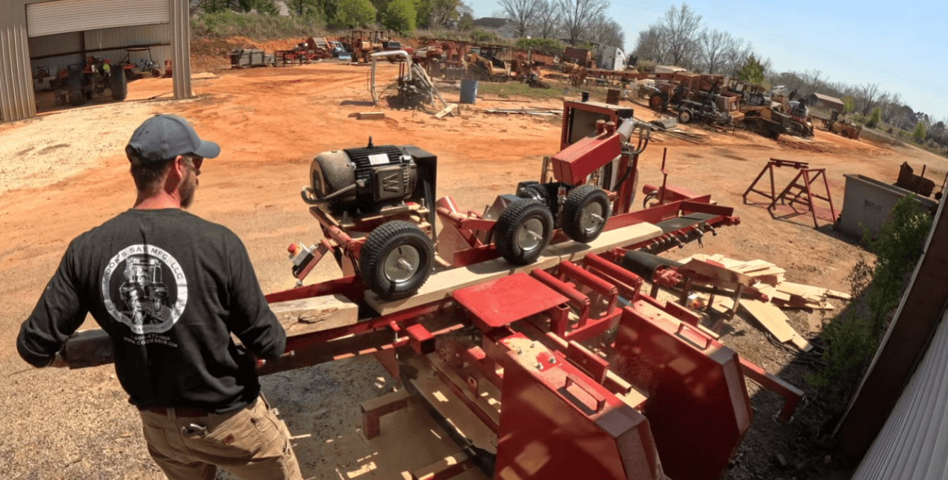 Operator using PR6 pallet resaw with dual cutting heads, high output pallet bandsaw machine increasing yield and reducing waste in lumber processing facility